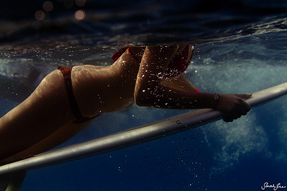 Female Surfer Underwater by Sarah Lee